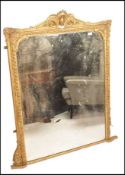 A large 18th / 19th century wall mirror of tall form having stunning gilt plaster frame with
