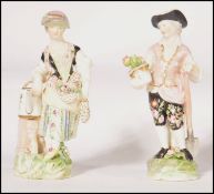 A pair of late 18th century German blue crossed swords, possibly Meissen porcelain figurines ' The