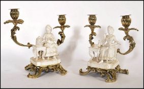 A pair of 18th century Georgian blanque de chine ceramic figurines of ladies seated raised on