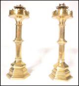A pair of believed Pugin 19th century Victorian heavy brass candlesticks of hexagonal column form