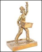 A 19th century Victorian brass go to bed vesta match striker in the form of a Peeler police man