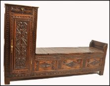 A 19th century country oak French hall settle coffer - cabinet chest. Of provincial form with