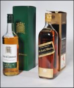 A boxed Johhne Walker Black Label Extra Special Old Scotch Whisky One Litre together with a boxed 12