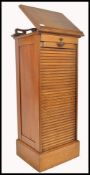 A 19th century mahogany tambour fronted office clerks filing cabinet lecturn with rise and fall