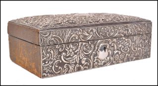 A 19th century Victorian silver hallmarked humidor / jewellery box having a rococo scrolled design
