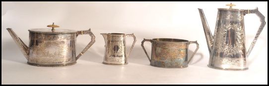 An Elkington & Co 4 piece silver plated tea service being chased with wreath and central monograms