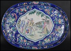 A stunning 18th century Qianlong period Chinese enamel cloisonne gallery edge tray on blue ground