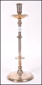 A 19th century silver plated ecclesiastical candlestick raised on a stepped circular base with