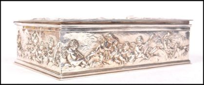 A fantastic 19th century silver plated jewellery casket box having relief scenes with cherubs /