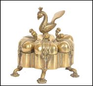 A 19th century Indian brass six person sectional spice box raised on flower head feet with six