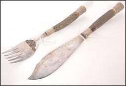 A pair of 19th century Victorian fish servers having stag horn handles with silver plated handles