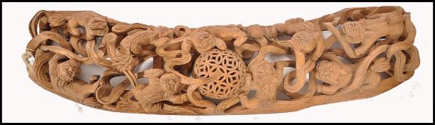 A large unusual believed 19th century Chinese hardwood carving puzzle ball wall sculpture. The large