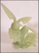 A Qing Dynasty (1644-1911) A Chinese white / light green Jade carved brush pot in the form of a