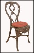 A 19th century eclesiastical cast and wrought iron chair in the manner of Coalbrookdale. The chair