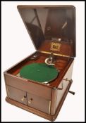 An early 20th century mahogany cased HMV / His Masters Voice table top gramophone, the hinged lid