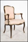 A 20th century French fauteil armchair of ebonised