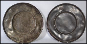 A pair of 18th century lead / pewter dinner plates