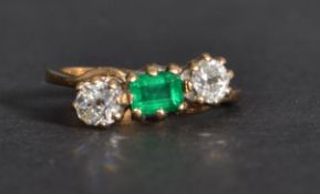 An 18ct gold diamond and emerald ring having appro
