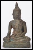 A Tibetan bronze buddha, 20th century, seated in t