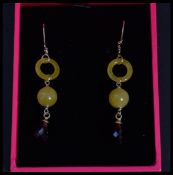 A pair of 14ct yellow gold citrine and garnet drop