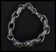 A sterling silver interlocking bracelet having pan