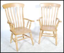 A pair of antique style beech wood Windsor style l
