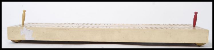 A 19th century Victorian ivorine cribbage board ra
