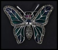 A sterling silver plique a jour brooch in the form