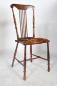 A pair of 19th century elm hoop back dining chairs