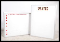 A pair of large advertising point of sale framed l