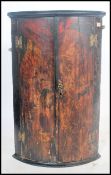 A 19th century chinoserie decorated corner cupboar