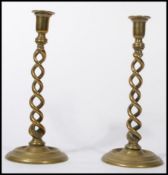 A pair of tall 19th century cast and spun brass ba