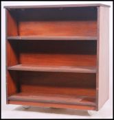 A retro mid 20th century teak wood library trolley