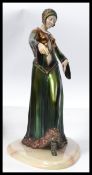A vintage Art Deco style statue figurine of a flapper girl. Raised on an onyx / marble base the