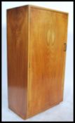 A 1930's Art Deco walnut bachelors wardrobe. Of sm