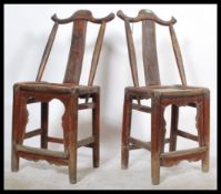 A pair of 19th Century Chinese middle Qing Dynasty yoke back side chairs with solid seats and square