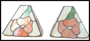 A pair of 20th Century Tiffany style stained lead glass lamp / ceiling  shades, each panel decorated