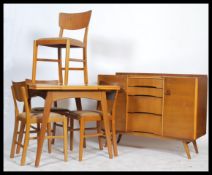 Avalon Yatton - A 1950's retro vintage teak wood dining suite comprising of an extending draw leaf