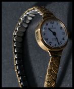 A ladies cocktail 9ct gold hallmarked  wristwatch, Excalibur to the enamel face set to an gilt