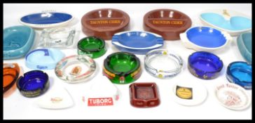 A collection of vintage 20th century advertising point of sale pub bar ashtrays to include Harp