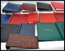 A very large collection of empty stamp , first day cover and postcards albums of various form with