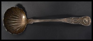 A fantastic Farrington & Hunnewell silver ladle in the Kings pattern with detached shell to
