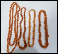A good group of amber type / resin necklaces of varying form. Please see images.