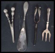A hallmarked silver handled shoe horn with engine turned handle along with a pair of silver