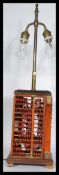 An unusual Chinese style table lamp of abacus form, constructed from four abacus in cube form.