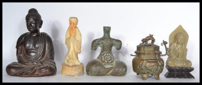 A late 19th / early 20th century Chinese Bronze lidded censor raised on four feet with temple dog