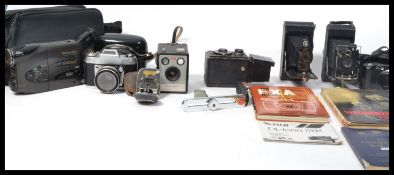 A collection of vintage 20th Century  cameras to include a Dollond Owl No 2 Bellows camera,