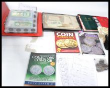 A collection of vintage stamps and documents along with a catalogued collection of vintage coins