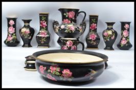 A large collection in Crown Ducal ceramics to include Washbowl and jug, large trophy shaped urn