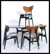 A set of four mid century retro G-Plan Librenza style dining chairs and matching extendable teak